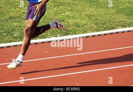 Runner on clay track Stock Photo