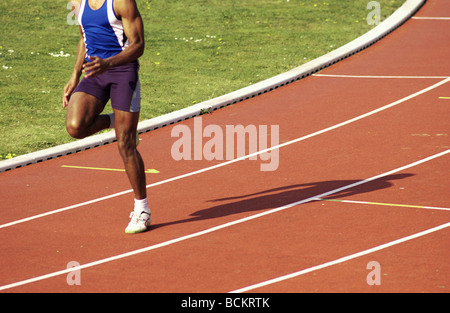 Runner on clay track Stock Photo