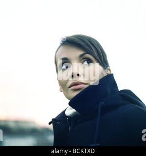 Woman wearing coat, head and shoulders Stock Photo