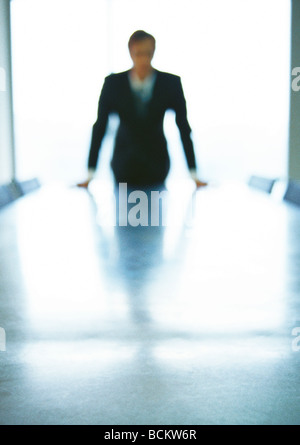 Businessman leaning on conference table, defocused Stock Photo