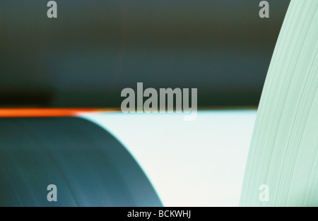 Paper on rolls in paper mill, close-up Stock Photo