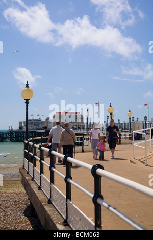 Tourists walking along Worthing Pier, West Sussex, UK Stock Photo