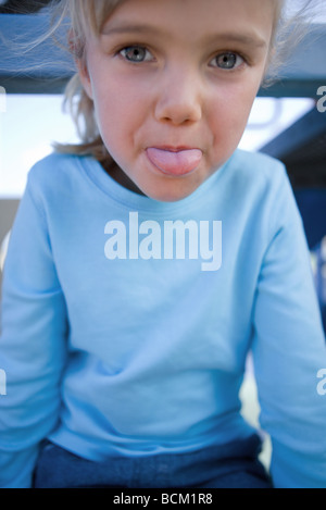 Girl sticking out tongue at camera, close-up Stock Photo