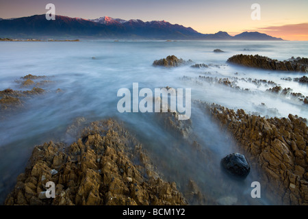 First light glows on the mountains of the Seaward Kaikoura ranges Kaikoura South Island New Zealand May 2007 Stock Photo