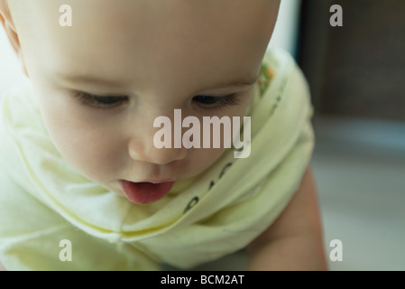 Baby looking down, close-up Stock Photo