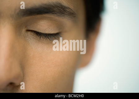 Man with eye closed, extreme close-up