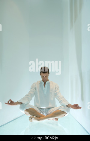 indian man meditating in lotus pose at home Stock Photo - Alamy