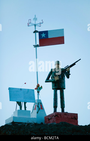 Soldier figurine standing beneath Chilean flag, holding rifle Stock Photo