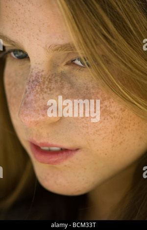 Young woman with red hair and freckles, close-up Stock Photo
