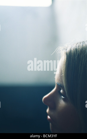 Young woman looking away, close-up, profile Stock Photo