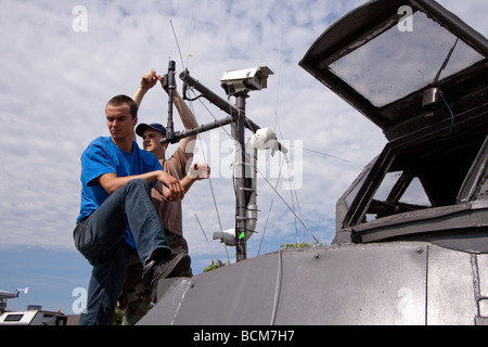 Members of Project Vortex 2 attach weather instrumentation to the Tornado Intercept Vehicle 2.  Project Vortex 2. Stock Photo