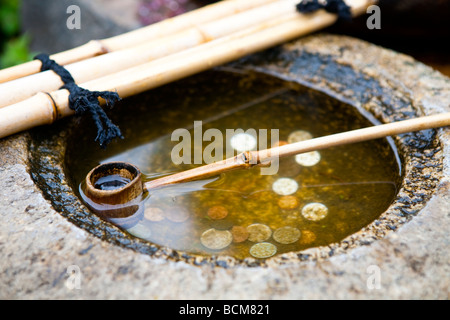 Garden wishing well installation in botanical garden in Tokyo Japan Stock Photo