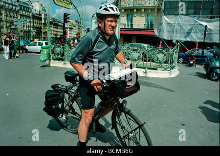 Paris France, Outside, Senior Man, Bicycling with Safety Helmut, people on the streets of Paris, french old man Stock Photo