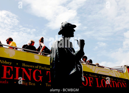 Sherlock Holmes statue and open top bus outside Baker Street station commissioned by Sherlock Holmes Society London England UK Stock Photo