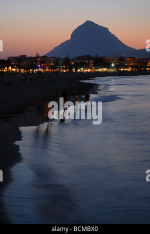 view along Arenal beach to Montgo at sunset, Javea / Xabia, Alicante Province, Comunidad Valenciana, Spain Stock Photo