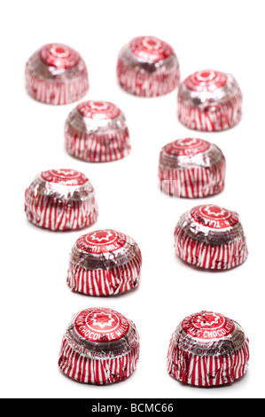 10 silver  and red "foil covered"  chocolate "tea cakes" Stock Photo