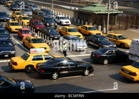 NYPD police officer directs traffic in Manhattan, NY Stock Photo