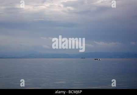 White Boat on Calm Water at Thermi Stock Photo