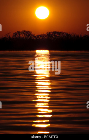 Sun and sunset over the Chobe river, Botswana, Africa Stock Photo