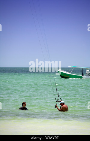 Man and Young woman kite surfing on Holbox island, Quintana Roo, Yucatán Peninsula, Mexico, a unique Mexican destination Stock Photo