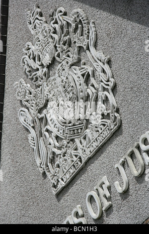 City of Truro, England. Close up angled view of the Royal Coat of Arms above the main entrance to Truro County Court. Stock Photo