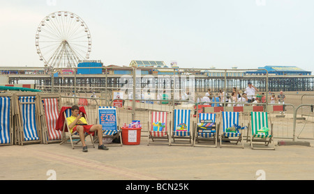 Deckchair attendant on Blackpool promenade in summer Stock Photo