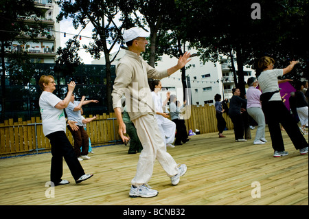 Paris, France, Medium group People, senior  activities, Adults Practicing "Chinese Exercise" "Tai Chi" at Paris Plages Public Event Summer Festival Stock Photo