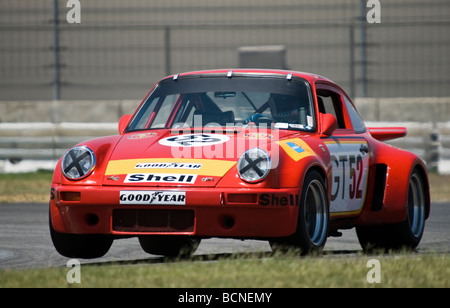 A 1974 Porsche 911 RSR races at a vintage racing event Stock Photo