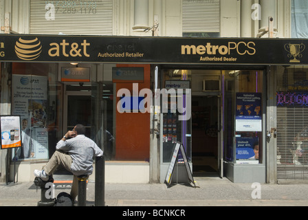 An AT T Wireless store competing with a Metro PCS store in New York