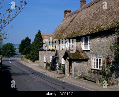 Street scene showing the Harbour Inn in the east Devon village of Axmouth Stock Photo