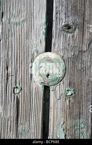 detail of keyhole on old wooden door Stock Photo