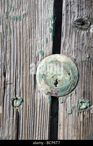 detail of keyhole on old wooden door Stock Photo