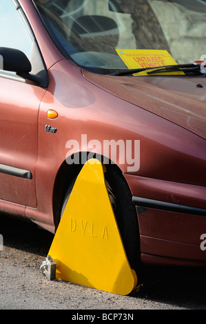 A CAR CLAMPED BY THE DVLA FOR BEING UNTAXED UK Stock Photo