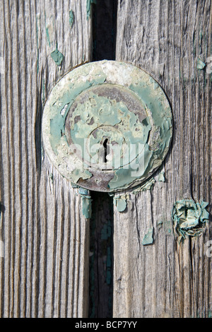 detail of keyhole on old wooden door Stock Photo