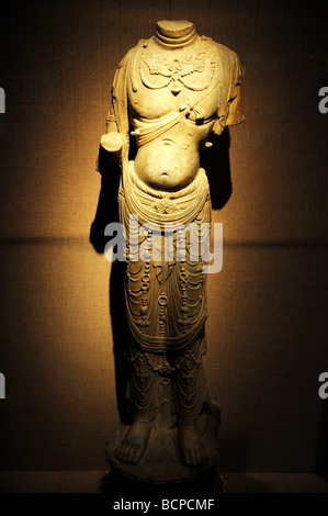 Exquisitely carved stone standing Buddha from Tang Dynasty, Capital Museum, Beijing, China Stock Photo