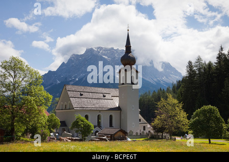 Biberwier Tyrol Austria Europe St Rochus Chapel and Zugspitze mountain highest peak in Germany in summer Stock Photo