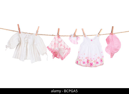 Baby Girl Clothing Hanging on a Clothesline Isolated on White Background Stock Photo