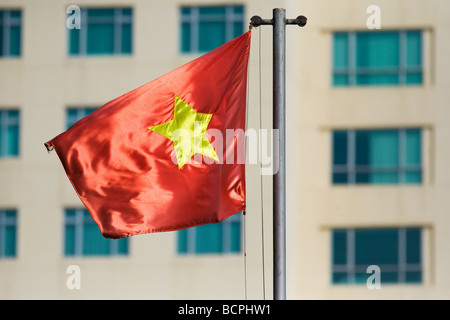 Vietnamese flag flying in Ho Chi Minh City, Vietnam Stock Photo