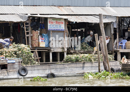 Shop in a floating village in the Mekong Delta, Vietnam Stock Photo