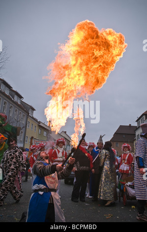 Man breathing fire during Carnival parade, Auerbach in der Oberpfalz, Bavaria, Germany Stock Photo