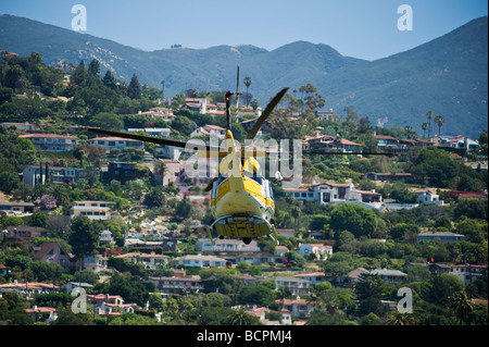 LA County Fire fighting helicopter flies in skies above Santa Barbara California during Jesusita fire May 6 2009 Stock Photo