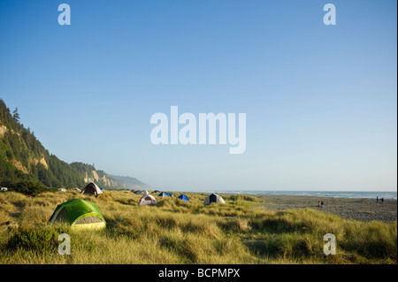 Tents camping in sand dunes at Gold Bluffs Beach, Prairie Creek Redwoods state park, California Stock Photo