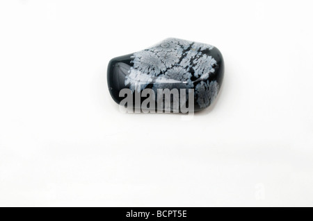 Cutout of a Snowflake Obsidian gemstone on white background Stock Photo