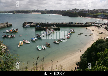 Town of Newquay, England. Elevated view of Newquay Harbour and beach with the town of Newquay and coastline in the background. Stock Photo