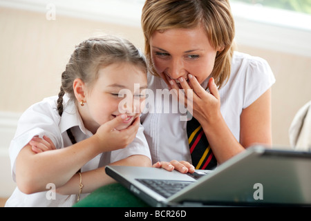 2 girls using on laptop Stock Photo