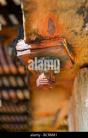 A rusty bolt on a pier support. Stock Photo