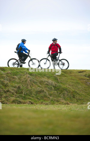 Mountain bikers on the south downs in the winter Stock Photo