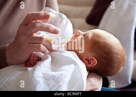 A newborn baby boy (7 days old) being bottle fed, London, England. Stock Photo