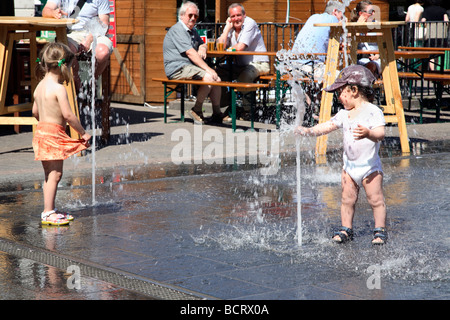 Cooling off in the fountain. Stock Photo