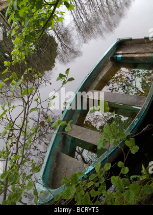 Abandoned boat on Dochart River Killin Scotland